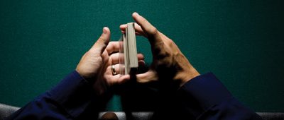 Close-up of hands shuffling a pack of cards